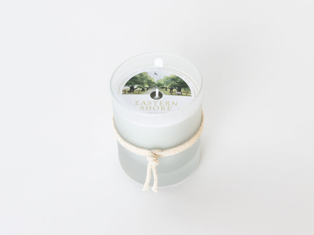 A Sunday Drive 6oz candle with dust cover, Eastern Shore Co. hand poured in very small batches, Scented candle, coconut soy wax, coastal candle, eastern shore, Chesapeake Bay, luxury candle, hand-poured, Maryland, Virginia, candle gift, coastal gift, Spring candle scents, spring scents, floral candle, floral scents, Sunday Drive, spring blossoms, sweet grass, fresh air, spring air, honeysuckle scent