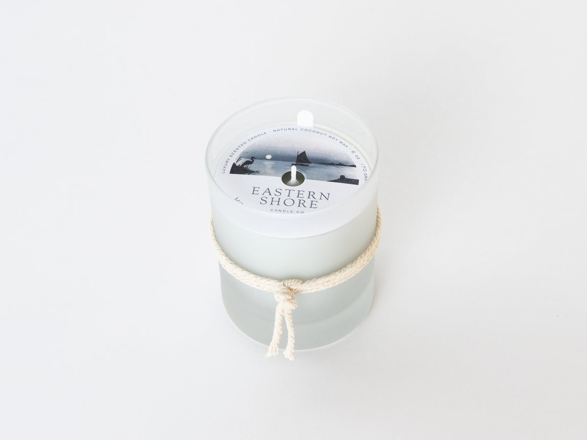 Moon over the River Miles 6oz candle with the illustration dust cover, Sailboat on the River Miles outside of St. Michaels in MD.  Eastern Shore Co.  Hand poured in very small batches on the eastern shore. saint michaels, st. michaels, moon, moonlight, moonlit, amber scent, jasmine scent, night blooms scent, summer candle, sultry candle, Scented candle, coconut soy wax, coastal candle, eastern shore, Chesapeake Bay, luxury candle, hand-poured, Maryland, Virginia, 